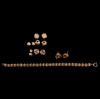 Lot 338 - Six pairs of gold and gold-plated earrings and a bracelet.