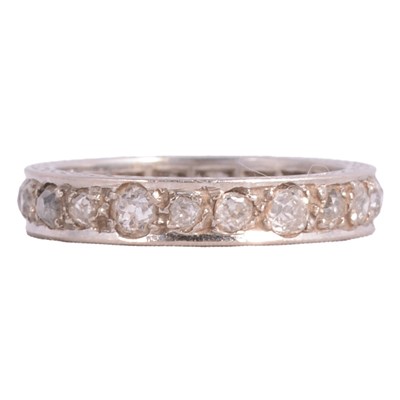 Lot 105 - A diamond full eternity ring.