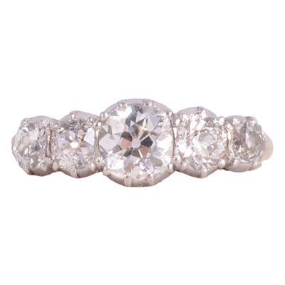Lot 79 - A diamond five stone ring.