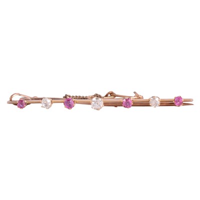 Lot 226 - A ruby and diamond bar brooch.
