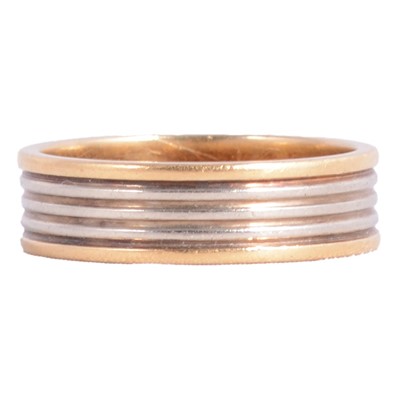 Lot 136 - A yellow and white gold band marked 750.
