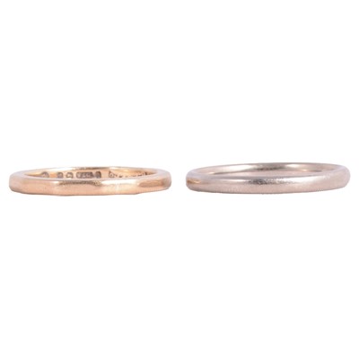 Lot 141 - An 18 carat white gold wedding band, a 9 carat yellow gold wedding band.