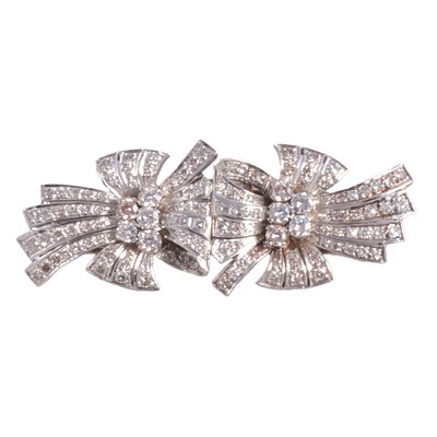 Lot 218 - A diamond set duette clip.