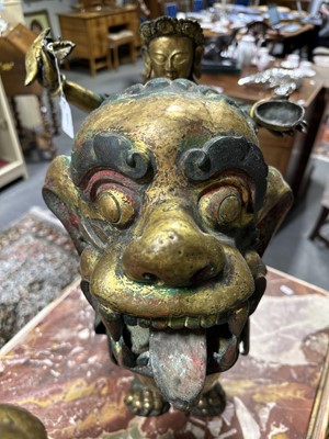 Lot 32 - Pair of 18th century Tibetan repousse copper snow lions with deities