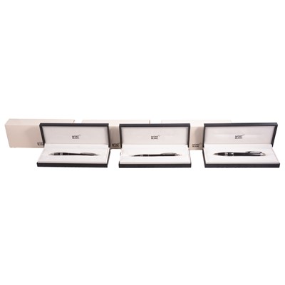 Lot 385 - Montblanc - Three Starwalker black resin retractable rollerball pens.