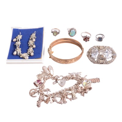 Lot 466 - A collection of silver and costume jewellery, charm bracelets, bangle rings etc.