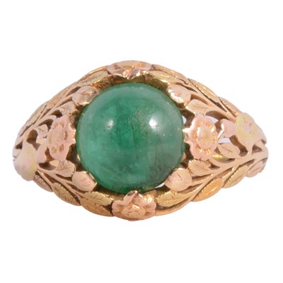 Lot 56 - An Arts and Crafts emerald ring.