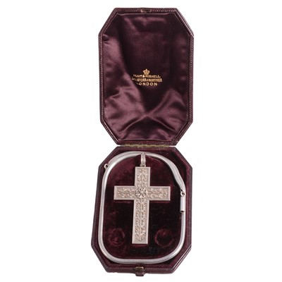 Lot 421A - A Victorian ornate white metal cross in fitted box with chain.