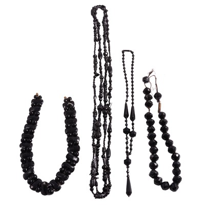 Lot 338 - A black jet style Victorian guard chain, two other necklaces and broken beads.