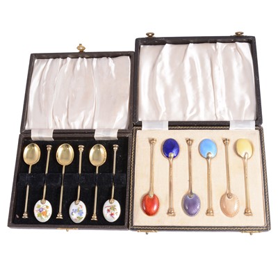 Lot 126 - Two sets of silver gilt and enamelled coffee spoons, cased
