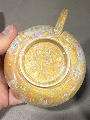 Lot 8 - Ruskin, two lustre cups and saucers, and a lustred bowl (attributed)