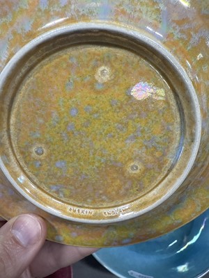 Lot 8 - Ruskin, two lustre cups and saucers, and a lustred bowl (attributed)