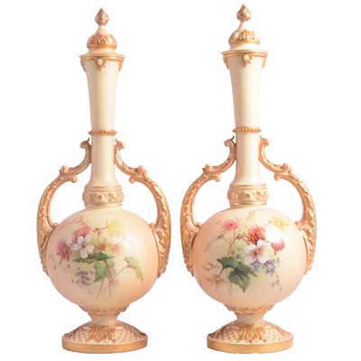 Lot 52 - Pair of Royal Worcester blush ivory twin handled vases with covers