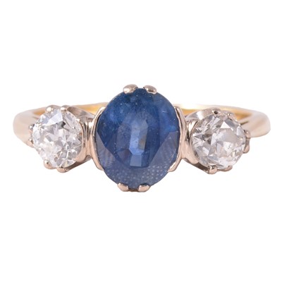 Lot 1 - A sapphire and diamond three stone ring.