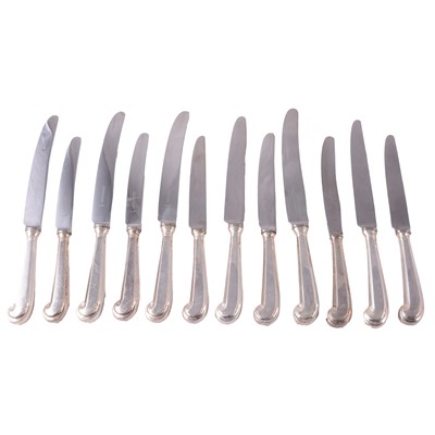 Lot 322 - Matched set of six silver pistol-handled table knives and six starter knives.
