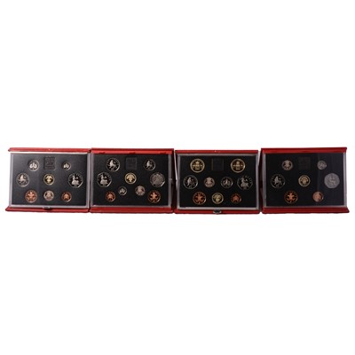 Lot 272 - Four red deluxe proof coin sets.