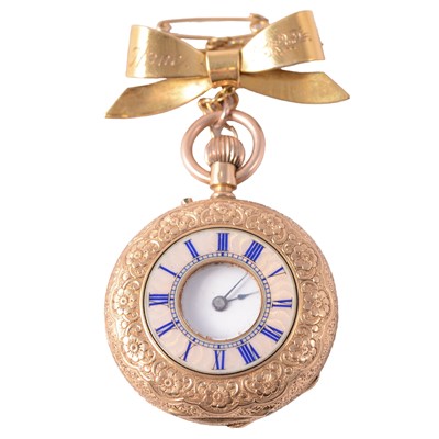 Lot 369 - A yellow metal demi-hunter fob watch on a 9 carat yellow gold bow brooch.