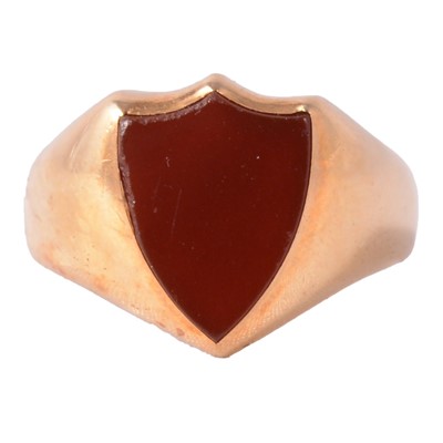 Lot 245 - A Victorian 18 carat yellow gold signet ring set with a shield shape cornelion.