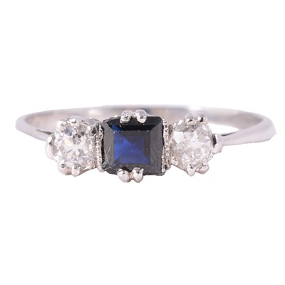 Lot 4 - A sapphire and diamond three stone ring.