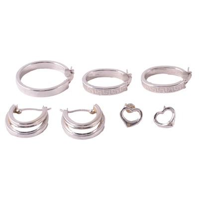 Lot 296 - Three pairs of 9 carat white gold earrings, and a single earring.