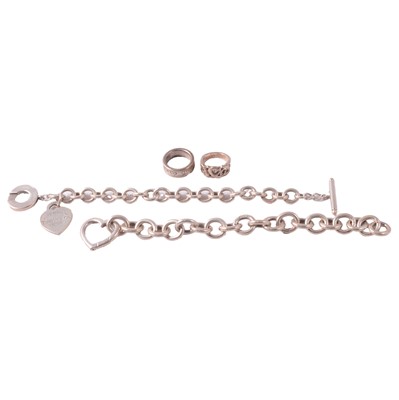 Lot 354 - Tiffany & Co - two silver rings, and two silver bracelets.