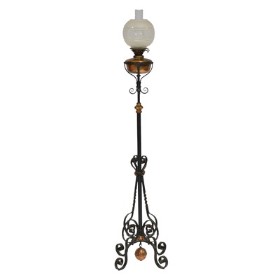 Lot 466 - Iron strapwork floorstanding oil lamp