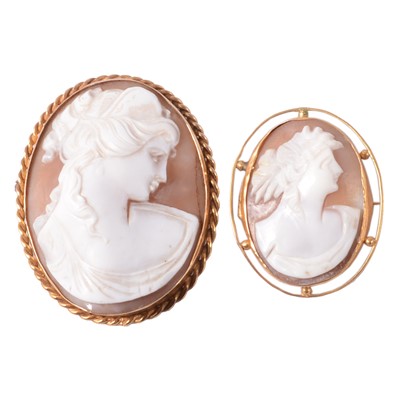 Lot 314 - Two oval carved shell cameo brooches.