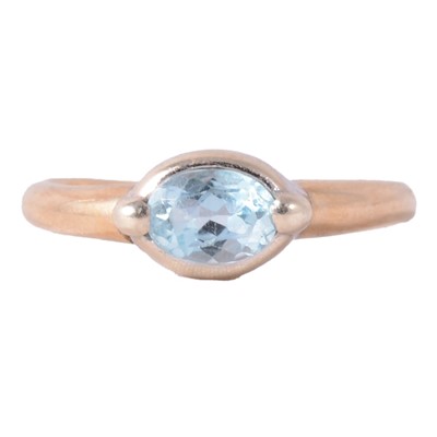 Lot 239 - A heat treated blue topaz solitaire ring.