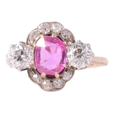 Lot 32 - A pink corundum and diamond cluster ring.