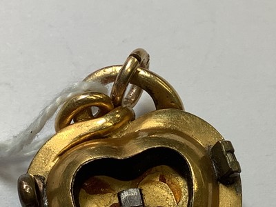 Lot 245 - A yellow metal heart shape pendant brooch set with turquoise.