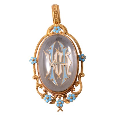 Lot 232 - An enamelled monogrammed pendant.