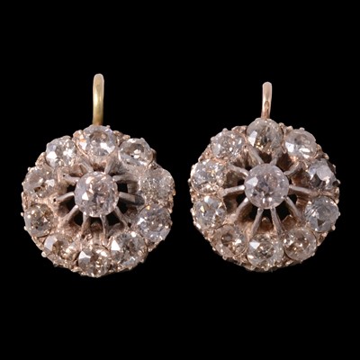 Lot 176 - A pair of diamond cluster earrings.