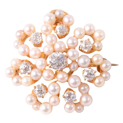 Lot 216 - A pearl and diamond floral design brooch.