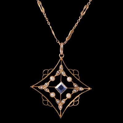 Lot 242 - An Edwardian seed pearl and sapphire pendant on a chain.