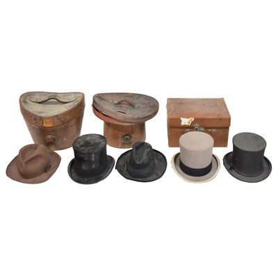 Lot 148 - Four vintage tophats, three bowler hats, leather hat boxes, etc