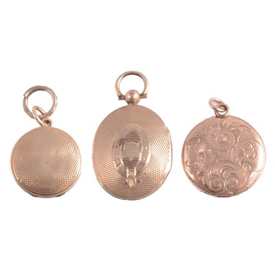 Lot 323 - Three vintage gold coloured lockets.