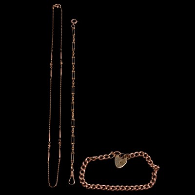 Lot 307 - A curb link bracelet and two chains.
