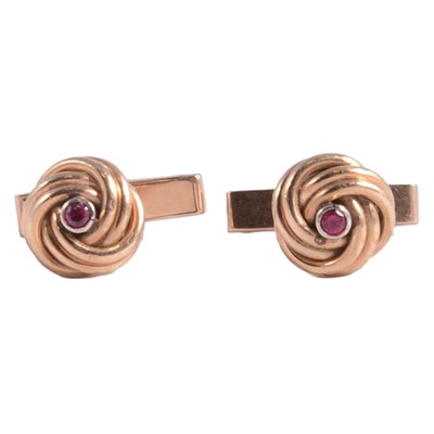 Lot 329 - A pair of knot design cufflinks.
