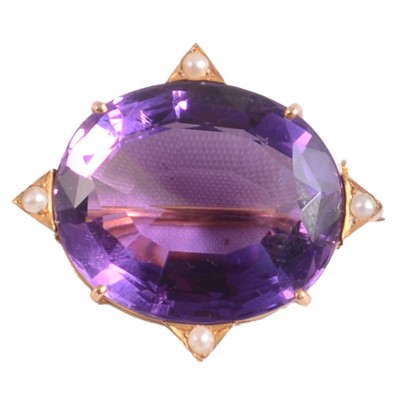 Lot 317 - An amethyst and pearl brooch.