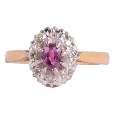 Lot 236 - A ruby and diamond cluster ring.