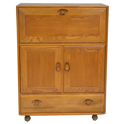 Lot 373 - Ercol elm cocktail cabinet/bar
