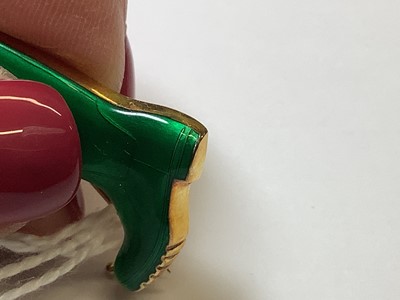 Lot 211 - Alabaster & Wilson - a 9 carat yellow gold and green enamel Wellington boot brooch.