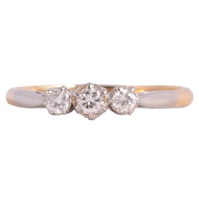 Lot 230 - A diamond three stone ring.