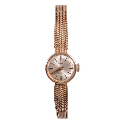 Lot 341 - A lady's 9 carat yellow gold bracelet watch.