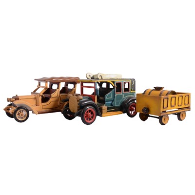 Lot 109 - A small tin trunk and a box of large model vehicles in metal and painted wood.