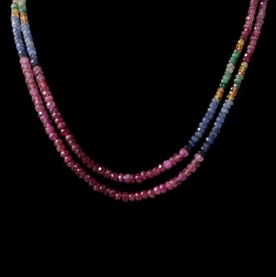 Lot 325 - A two strand ruby, sapphire, emerald and citrine bead necklace.