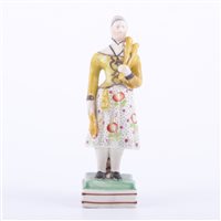 Lot 49 - Staffordshire earthenware figure of lady...