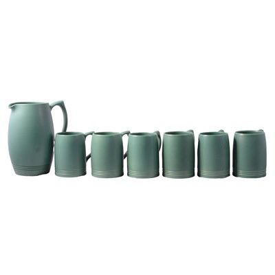 Lot 32 - Keith Murray for Wedgwood - a matt green glaze jug and tankards.