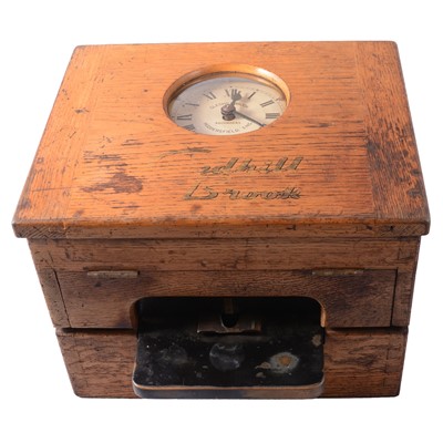 Lot 112 - Gledhill Brook, Huddersfield, an oak tabletop clocking-in machine