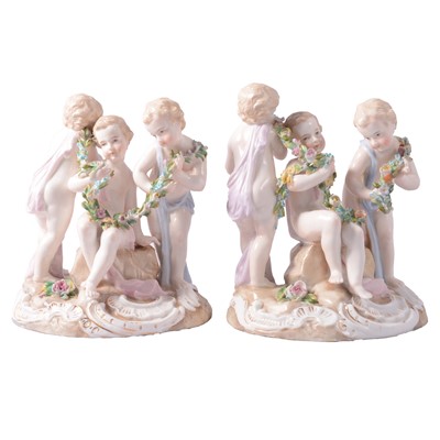 Lot 9 - Pair of continental figure groups, three putti to each.